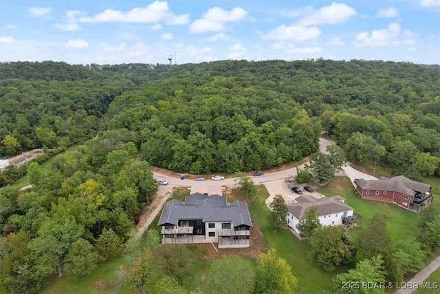 drone / aerial view with a view of trees