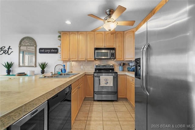 kitchen with tasteful backsplash, wine cooler, appliances with stainless steel finishes, light tile patterned flooring, and a sink