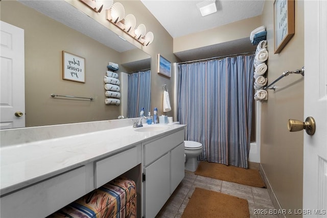 bathroom featuring vanity, baseboards, tile patterned flooring, shower / tub combo, and toilet