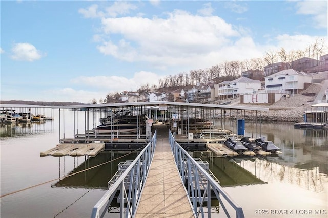 view of dock featuring boat lift and a water view