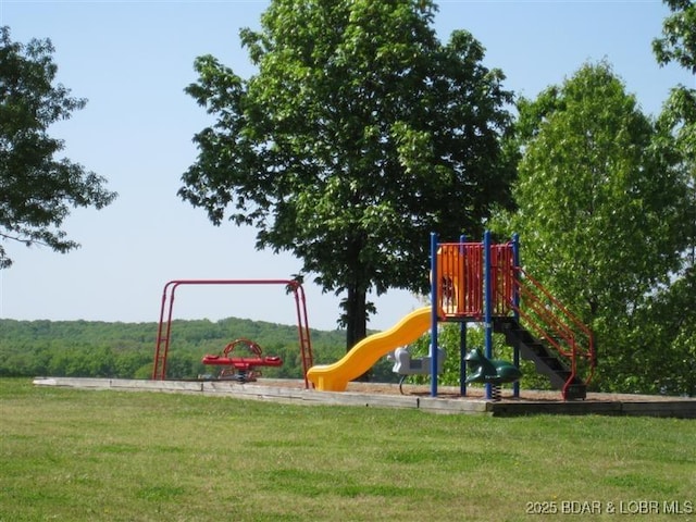 community jungle gym with a lawn