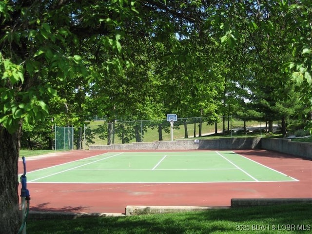 view of sport court with fence