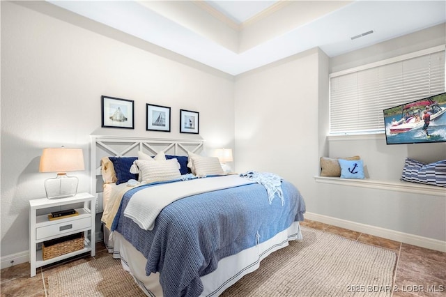 bedroom with visible vents and baseboards