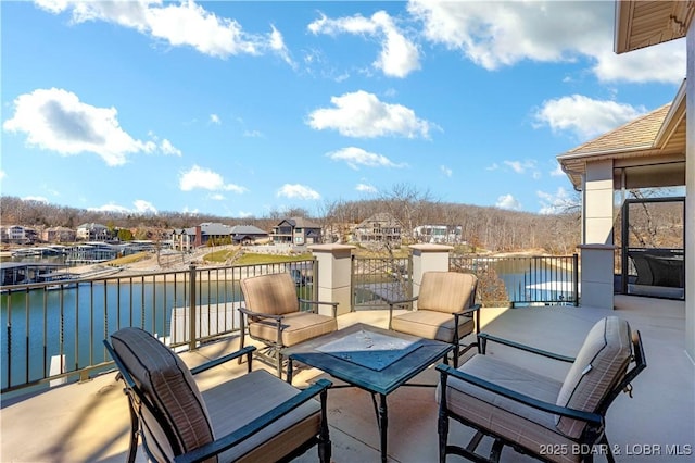 view of patio featuring a water view and outdoor lounge area