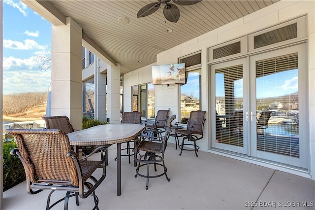 view of patio / terrace featuring outdoor dining area and a ceiling fan