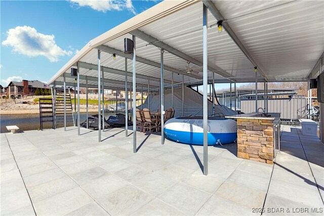 view of patio / terrace featuring a boat dock