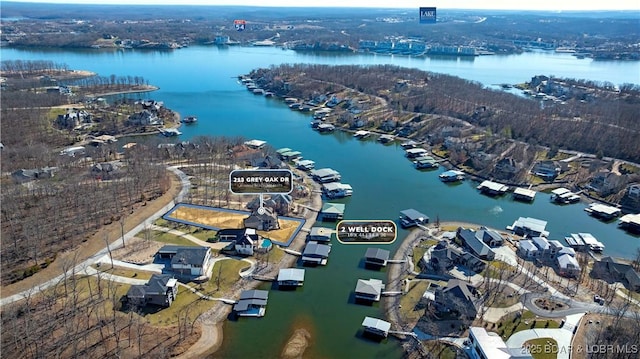 birds eye view of property with a water view