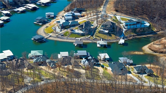 bird's eye view with a residential view and a water view