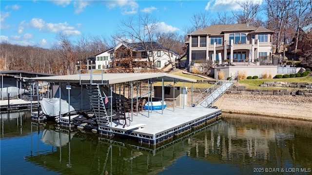 dock area featuring boat lift and a water view