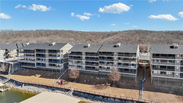 birds eye view of property with a water view