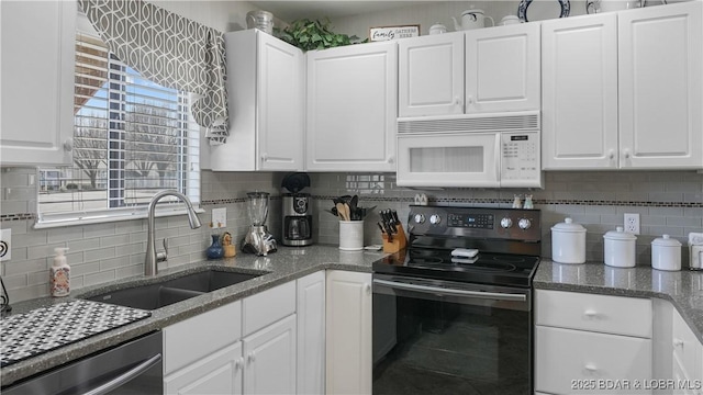 kitchen featuring white microwave, a sink, electric stove, stainless steel dishwasher, and backsplash