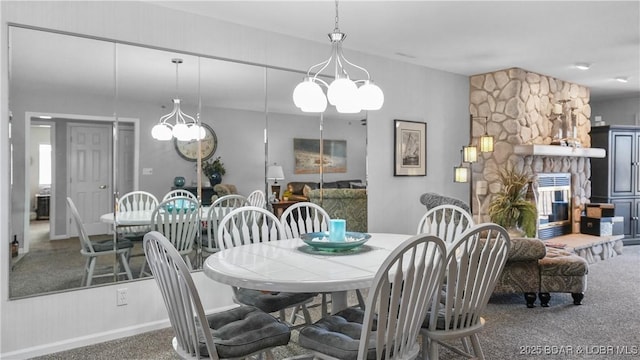 carpeted dining space featuring a fireplace