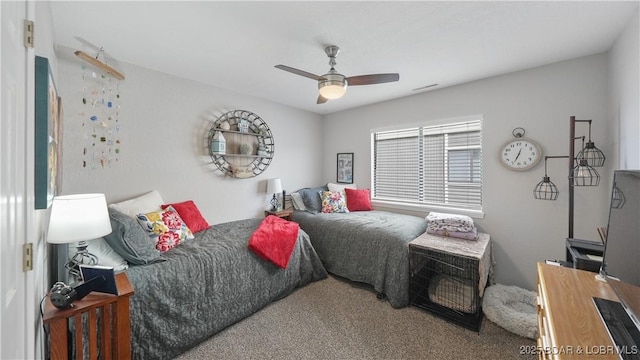 carpeted bedroom featuring visible vents and ceiling fan