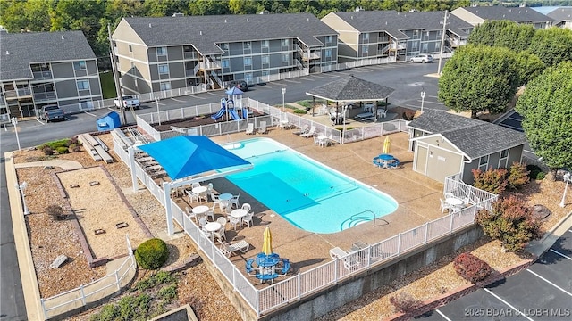 birds eye view of property with a residential view