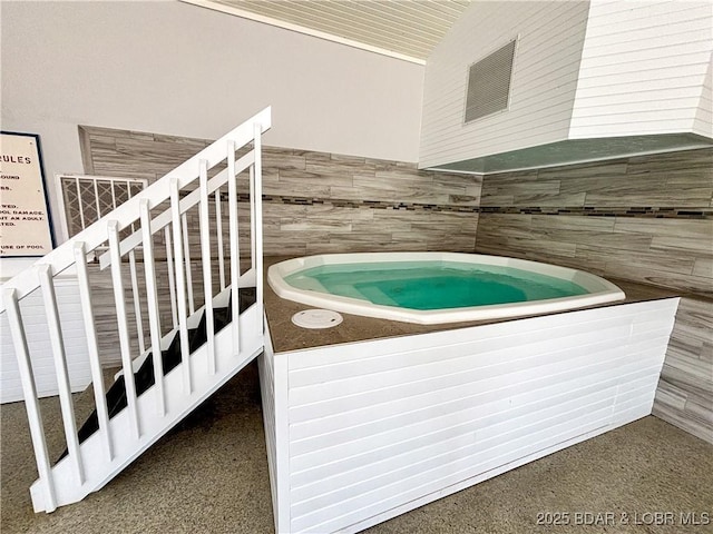 interior space with a jacuzzi