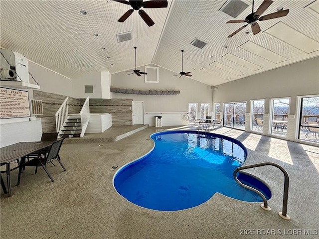 indoor pool with a jacuzzi