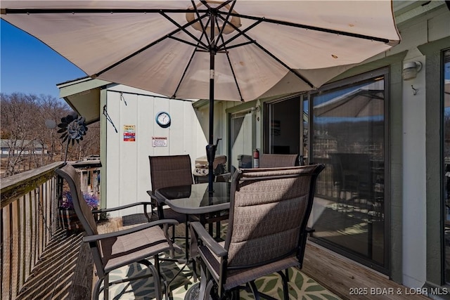 deck featuring outdoor dining area