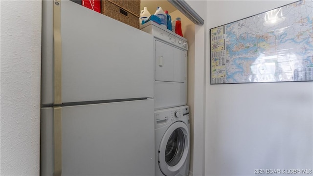 washroom with laundry area and stacked washer and dryer