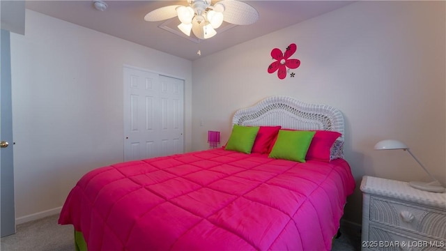 carpeted bedroom with baseboards and ceiling fan