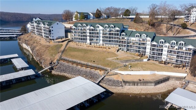 birds eye view of property featuring a water view