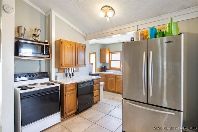 kitchen featuring light countertops, ornamental molding, stainless steel appliances, light tile patterned flooring, and a textured ceiling