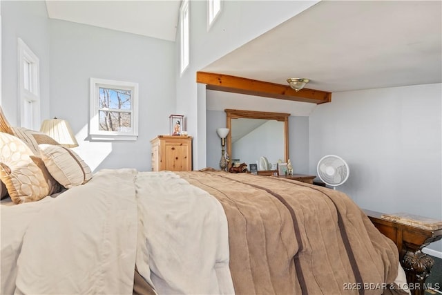 bedroom featuring lofted ceiling with beams