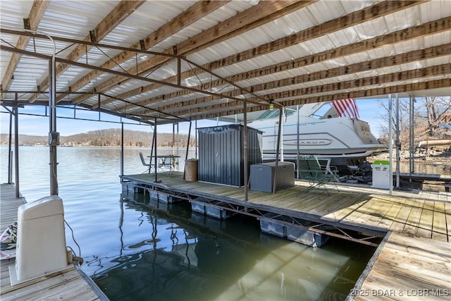 dock area featuring a water view and boat lift