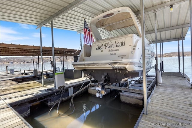 view of dock with a water view and boat lift