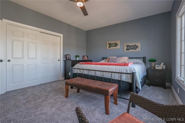 carpeted bedroom with baseboards and ceiling fan