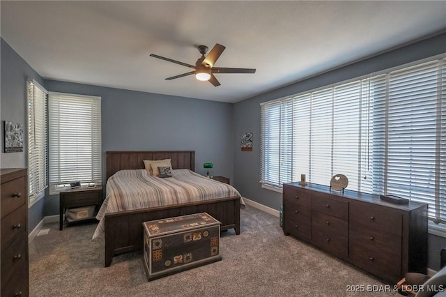 bedroom with baseboards, carpet floors, and a ceiling fan