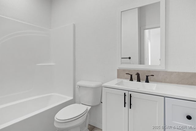 bathroom with vanity, toilet, and washtub / shower combination