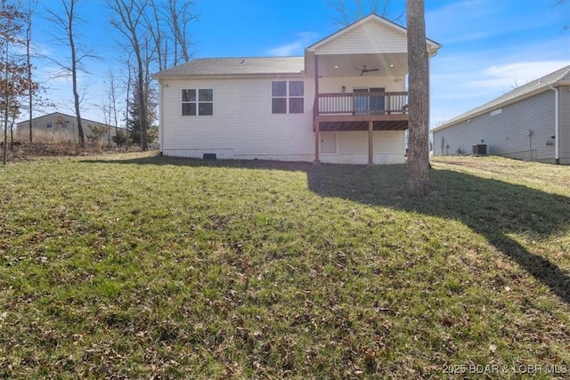 back of house with a lawn