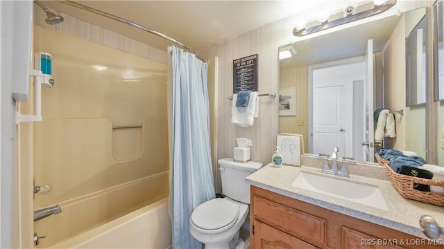 bathroom with shower / bathtub combination with curtain, toilet, and vanity