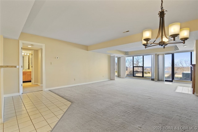 unfurnished living room featuring light carpet, a notable chandelier, visible vents, and baseboards