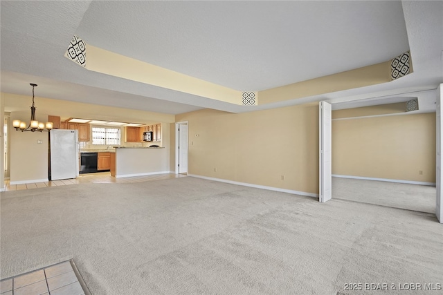 unfurnished living room featuring baseboards, light colored carpet, an inviting chandelier, and light tile patterned flooring