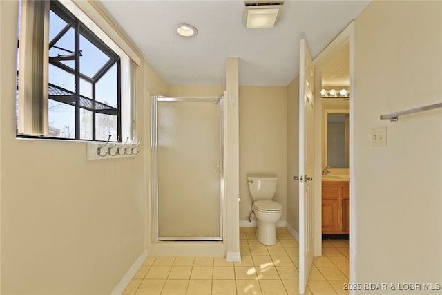 bathroom featuring toilet, a stall shower, tile patterned flooring, baseboards, and vanity