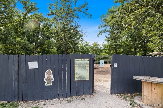 view of gate with fence