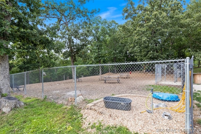 view of property's community featuring fence