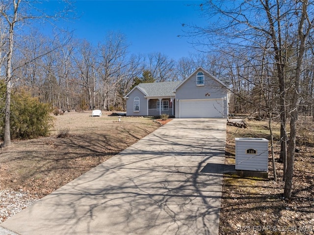 view of front of property featuring a garage and concrete driveway