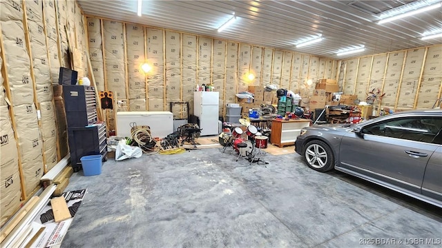 garage with freestanding refrigerator