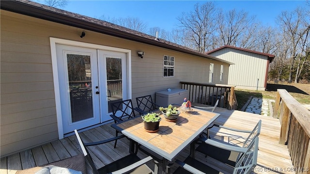 wooden deck with french doors and outdoor dining space