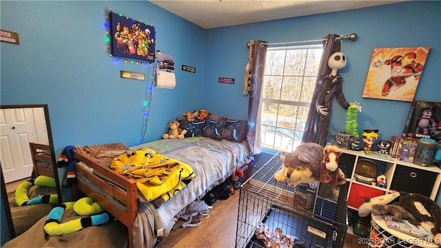 bedroom featuring wood finished floors