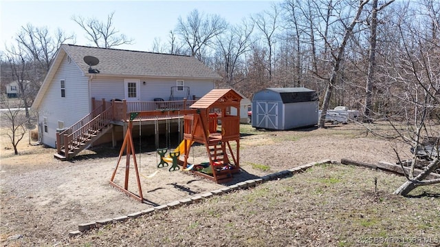 exterior space featuring a deck, an outbuilding, stairs, and a shed