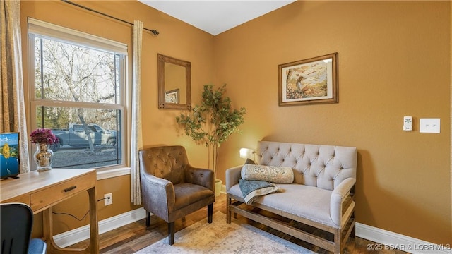 sitting room featuring wood finished floors and baseboards