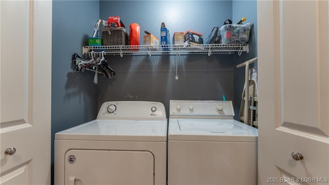 washroom featuring laundry area and washing machine and dryer