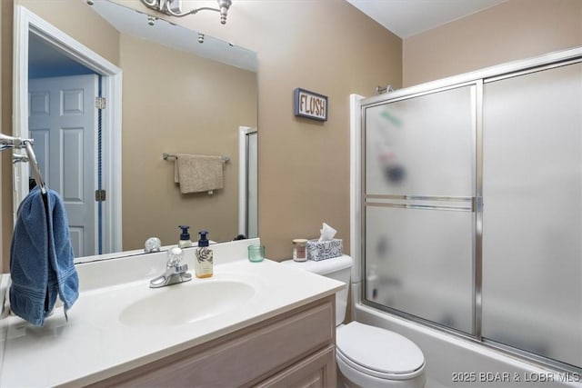 222 Park Place Ln Unit 2C, Kaiser, MO 65047 - bathroom featuring vanity, combined bath / shower with glass door, and toilet