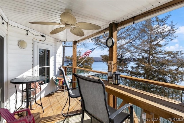 wooden deck with a ceiling fan