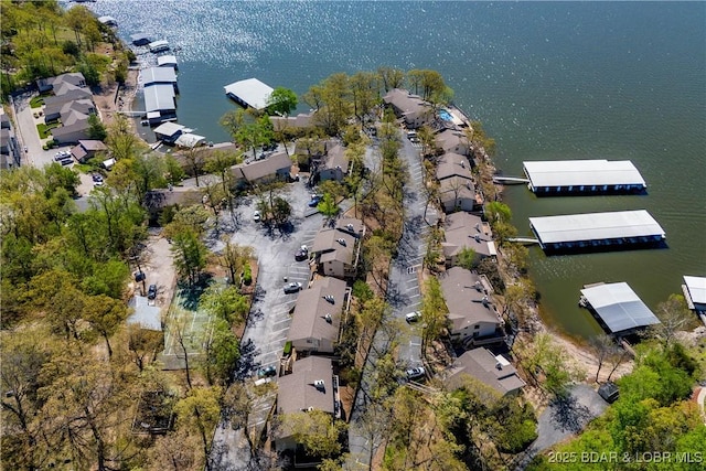 drone / aerial view with a residential view and a water view