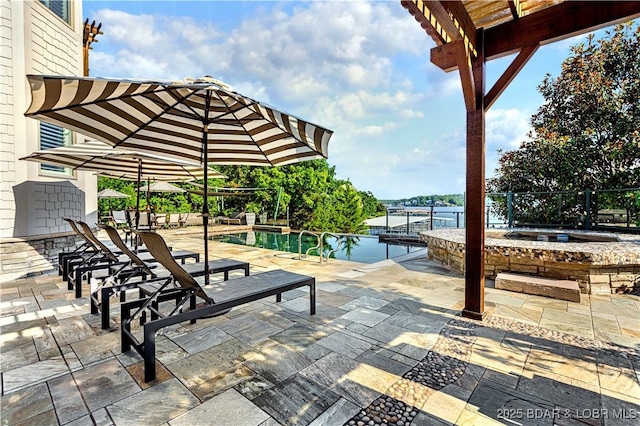 view of patio / terrace featuring an outdoor pool