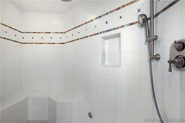 full bath featuring tiled shower